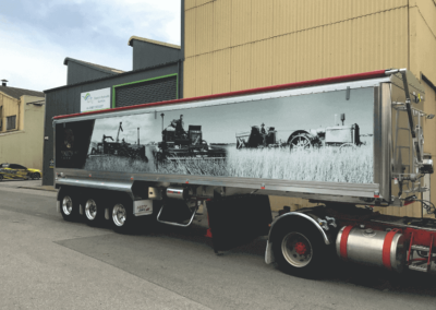 A semi’s very long trailer features a dramatic large format printed sign on the trailers side